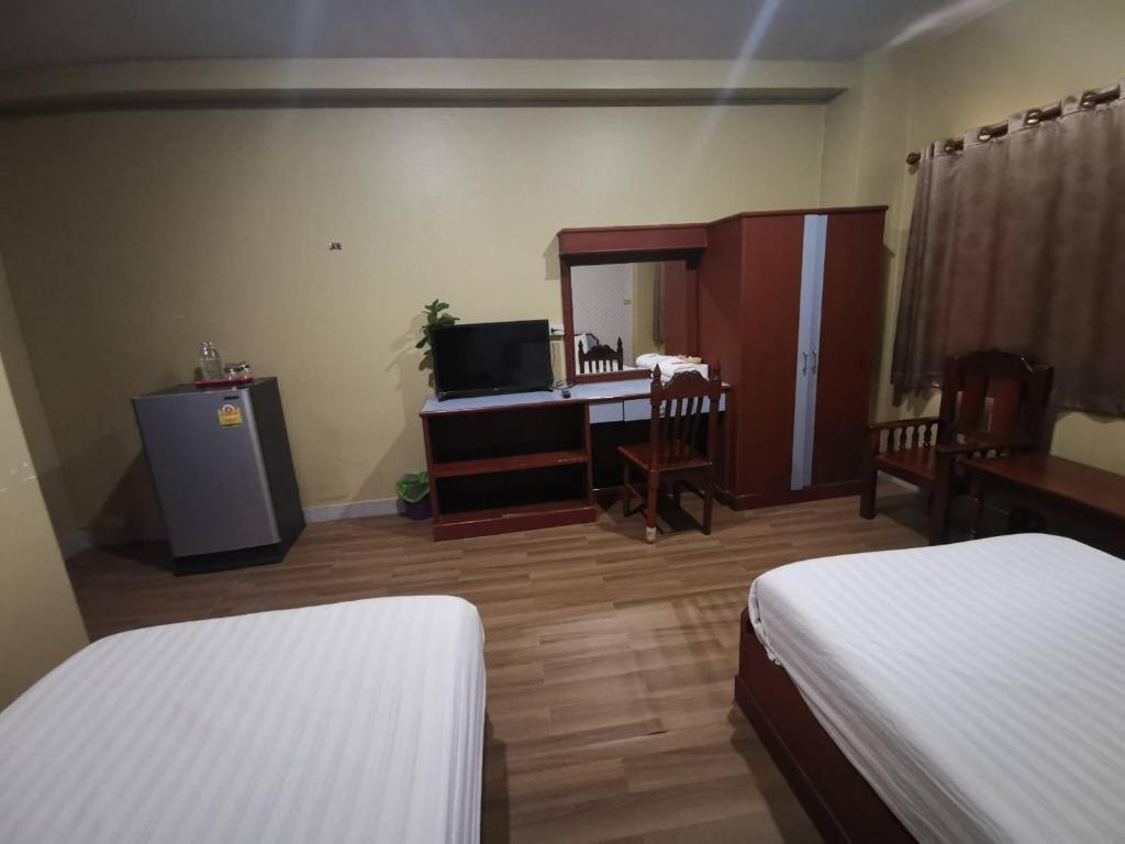 Postel nebo postele na pokoji v ubytování Metro Residence
