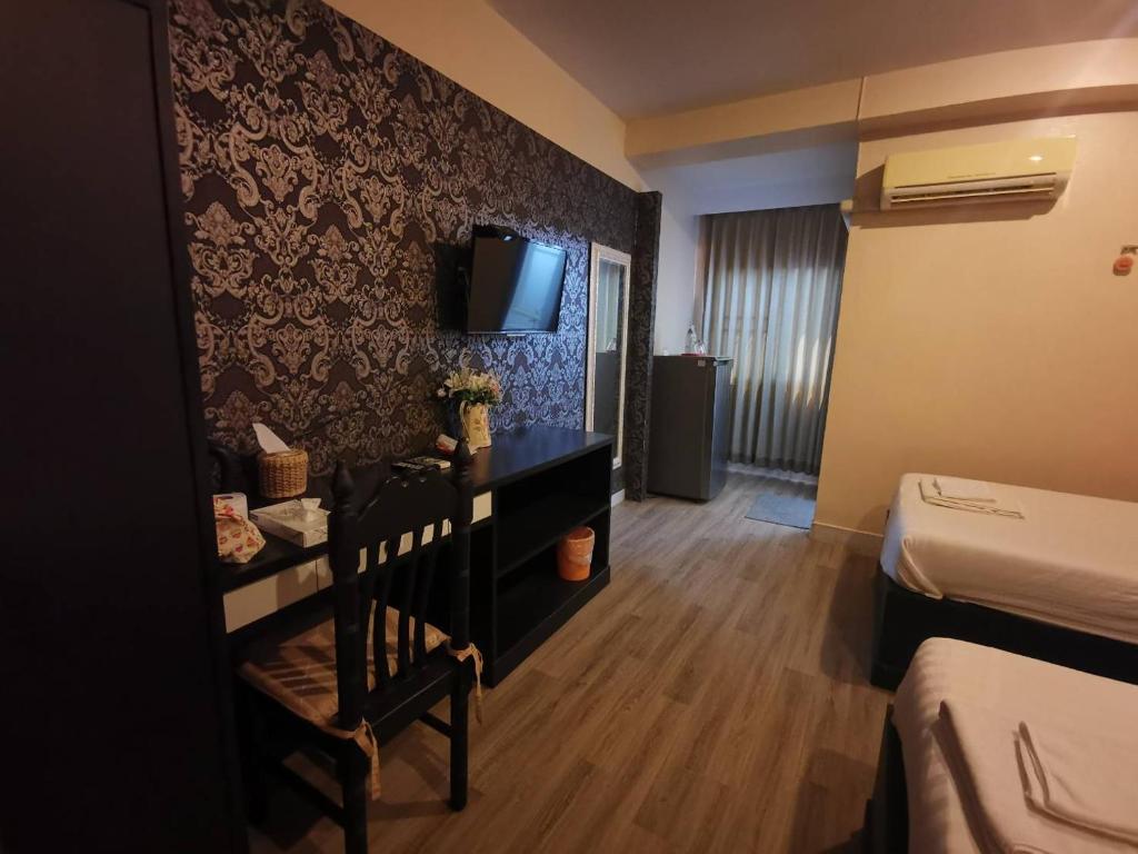Postel nebo postele na pokoji v ubytování Metro Residence