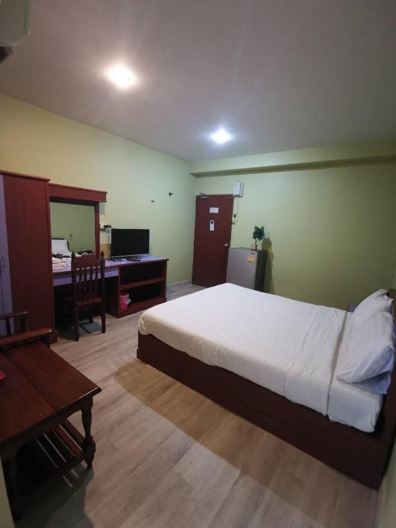 Postel nebo postele na pokoji v ubytování Metro Residence