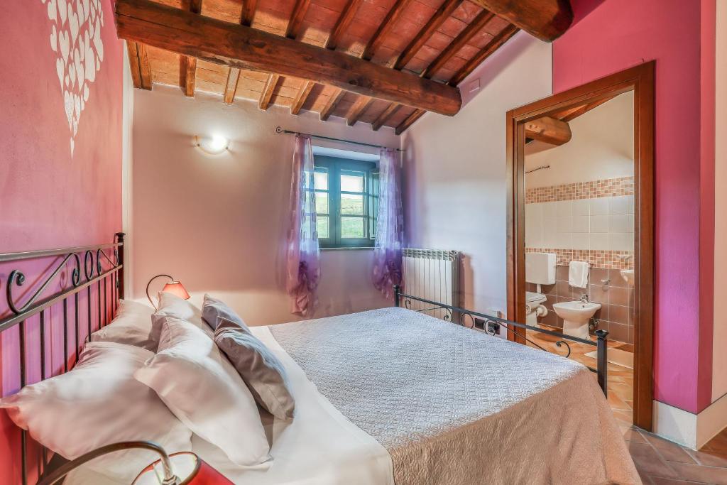 Łóżko lub łóżka w pokoju w obiekcie Agriturismo Podere San Giorgio