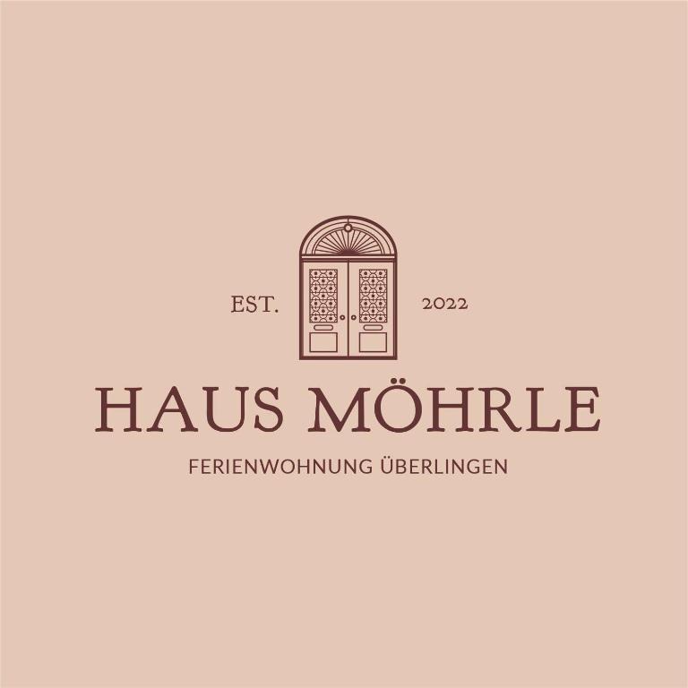 een logo voor een ijzerwinkel met een deur bij Ferienhaus Möhrle 6 in Überlingen