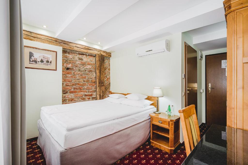 Postel nebo postele na pokoji v ubytování Hotel Solaris