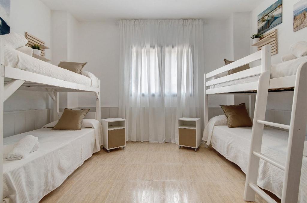Postel nebo postele na pokoji v ubytování El Altillo House