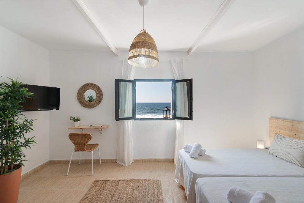 Postel nebo postele na pokoji v ubytování El Altillo House