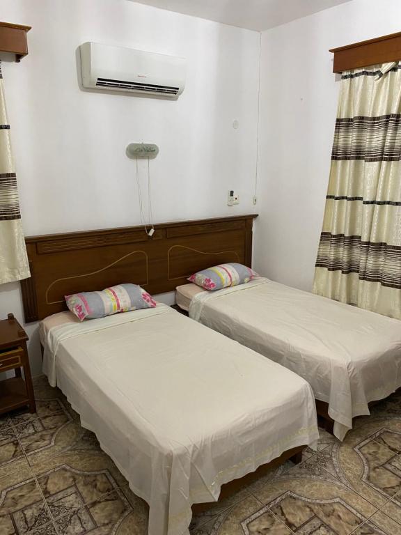 Postel nebo postele na pokoji v ubytování Apartments la Colombe