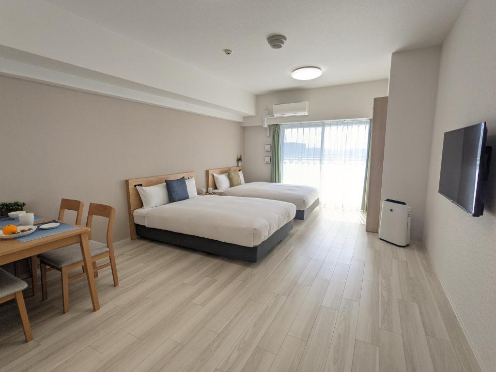 Μια τηλεόραση ή/και κέντρο ψυχαγωγίας στο ESLEAD HOTEL Namba Daikokucho