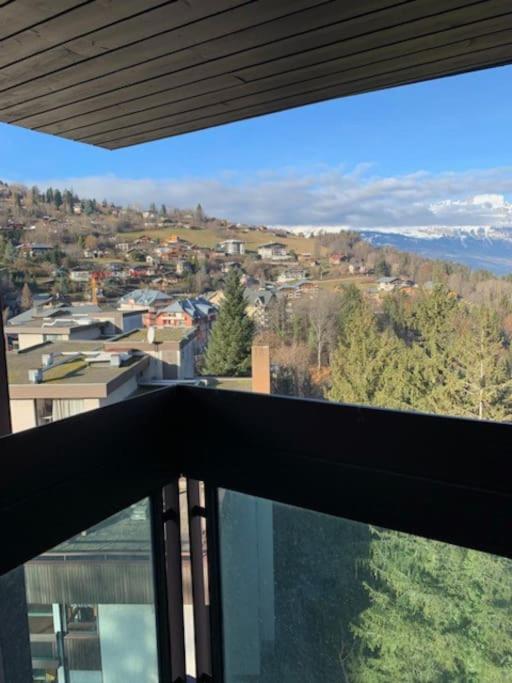 a view of a city from a balcony of a house at Duplex St Gervais rooftop - 500m des télécabines in Saint-Gervais-les-Bains