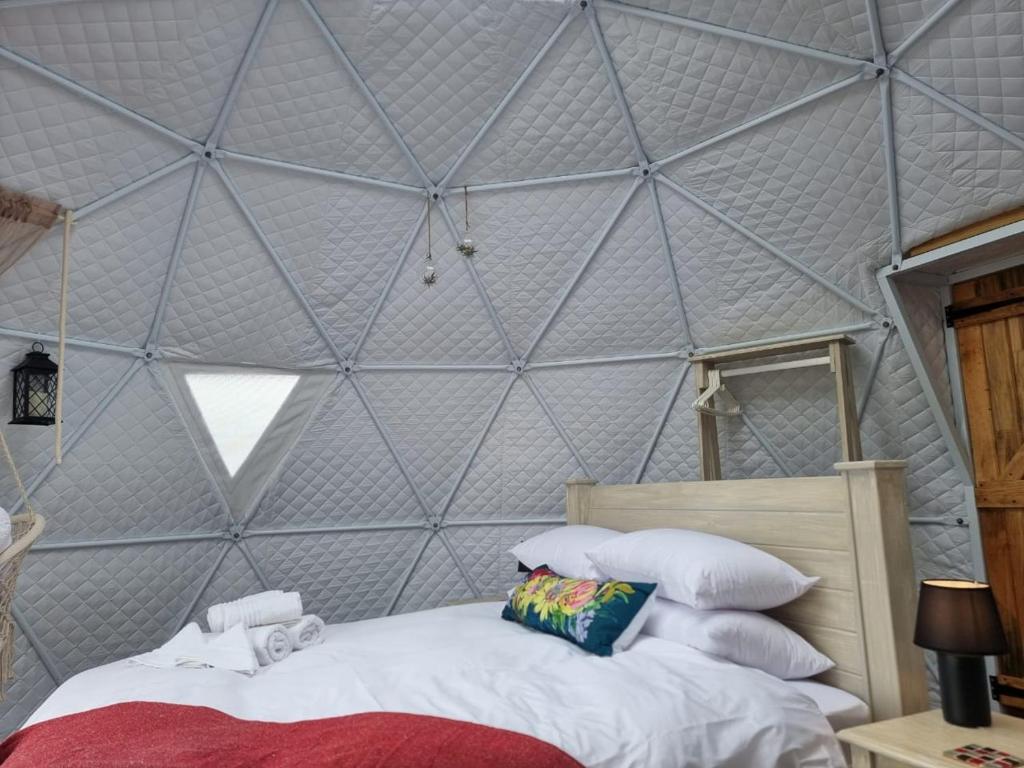 Postel nebo postele na pokoji v ubytování Pom Gratz - EcoDomes