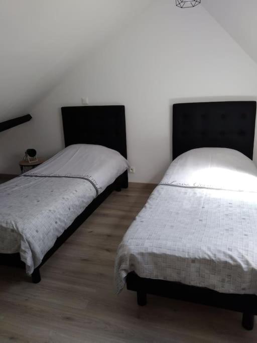 Posteľ alebo postele v izbe v ubytovaní Petite maison de l'ancien rivage