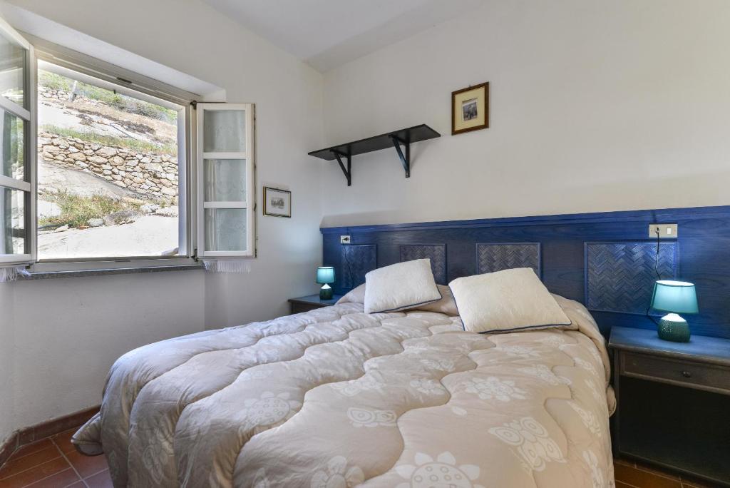 Postel nebo postele na pokoji v ubytování Casa Ebaté