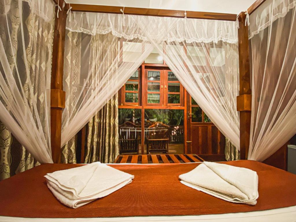 Postel nebo postele na pokoji v ubytování Hotel Levon Ella