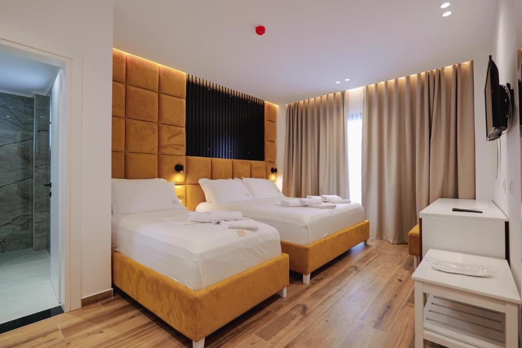 Postel nebo postele na pokoji v ubytování HOTEL RENATO