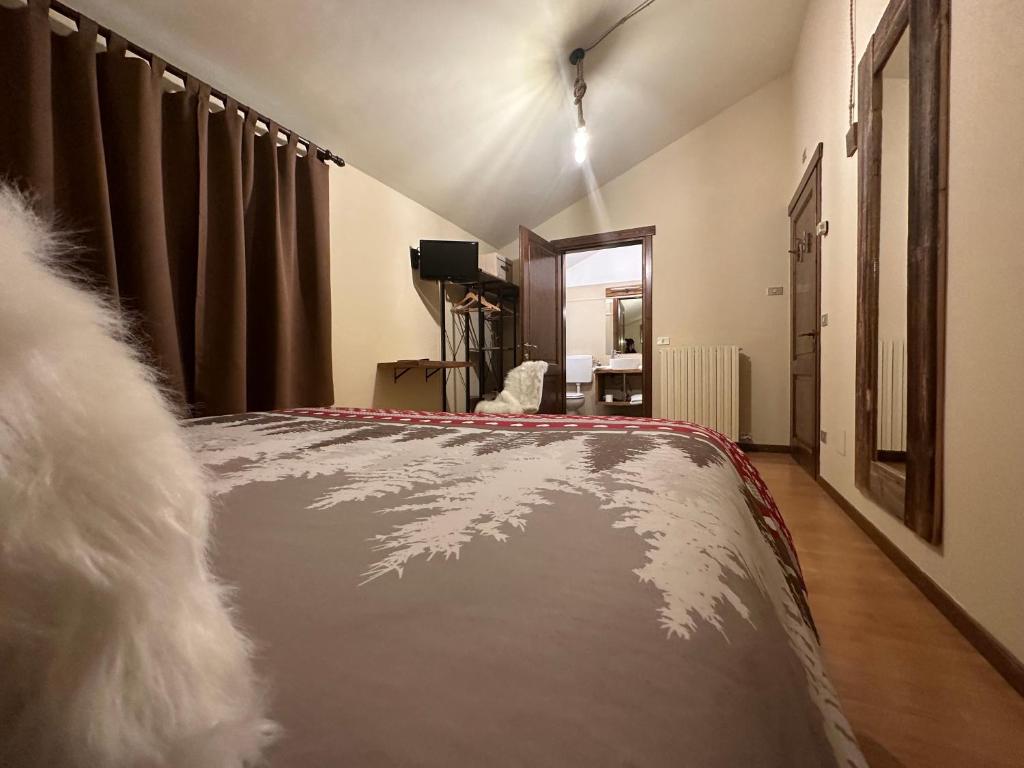 Postel nebo postele na pokoji v ubytování Hotel Le Clou