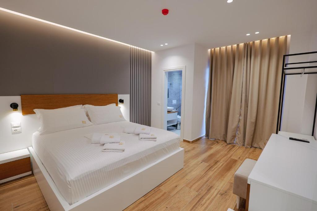 Postel nebo postele na pokoji v ubytování HOTEL RENATO