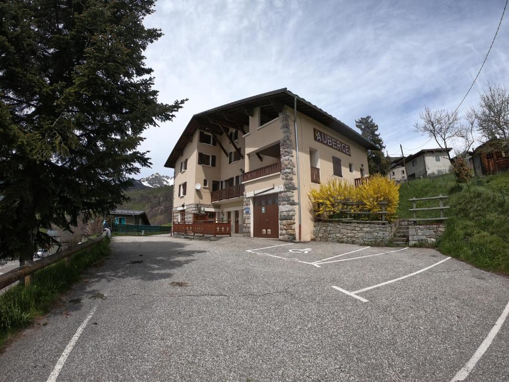 a parking lot in front of a building at Auberge Le Valezan in Valezan