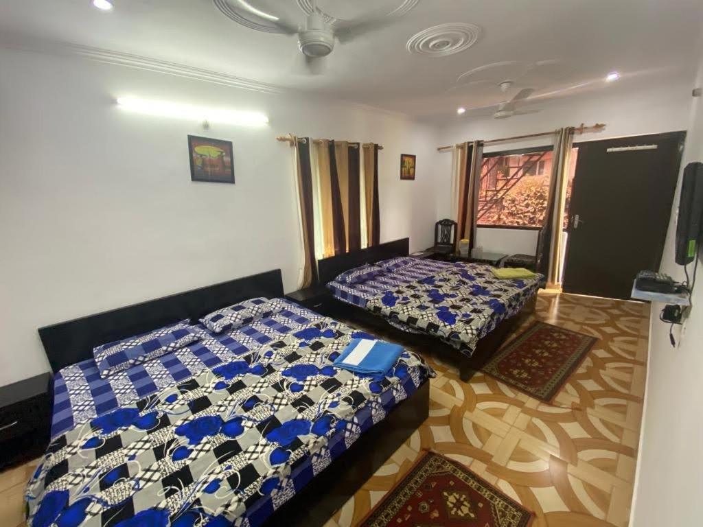 Postel nebo postele na pokoji v ubytování Sunrest Villa