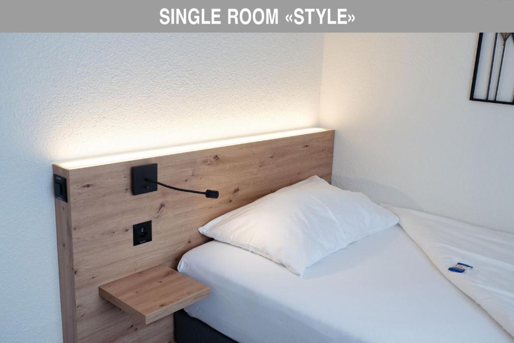 Postel nebo postele na pokoji v ubytování Hotel Bären Suhr