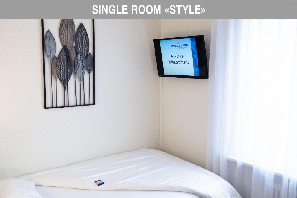 Postel nebo postele na pokoji v ubytování Hotel Bären Suhr