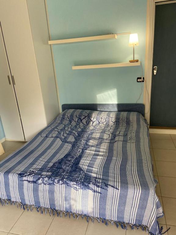 Postel nebo postele na pokoji v ubytování MONOLOCALE ESTENSI