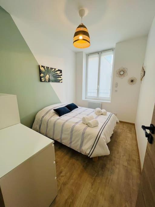 Posteľ alebo postele v izbe v ubytovaní Appartement cosy centre-ville