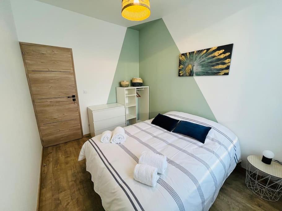 Posteľ alebo postele v izbe v ubytovaní Appartement cosy centre-ville