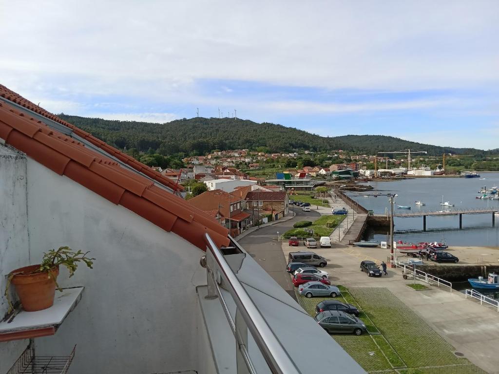 a view of a marina from the balcony of a building at Casa Adrián in Sabardes