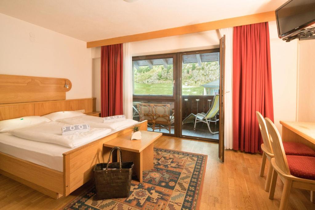 Postel nebo postele na pokoji v ubytování Piccolo Hotel Gurschler