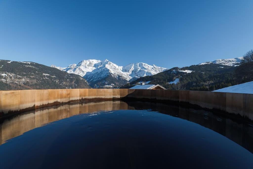 a view of a mountain range from a reservoir at L'ivresse du Mont-Blanc in Saint-Gervais-les-Bains