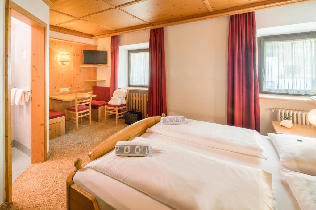 Postel nebo postele na pokoji v ubytování Piccolo Hotel Gurschler