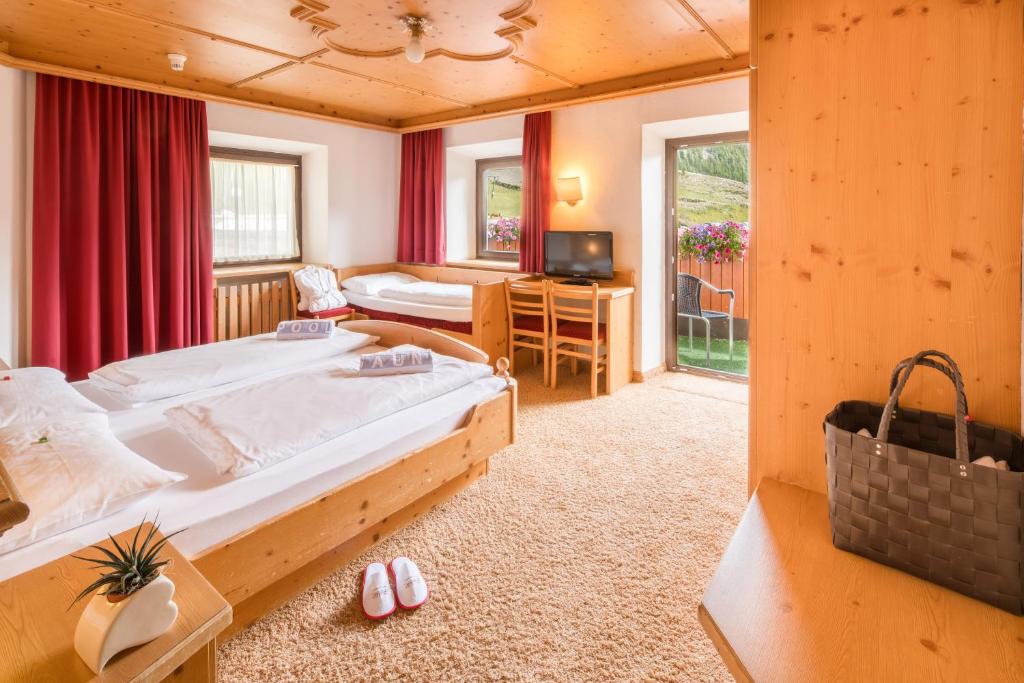 Postel nebo postele na pokoji v ubytování Piccolo Hotel Gurschler