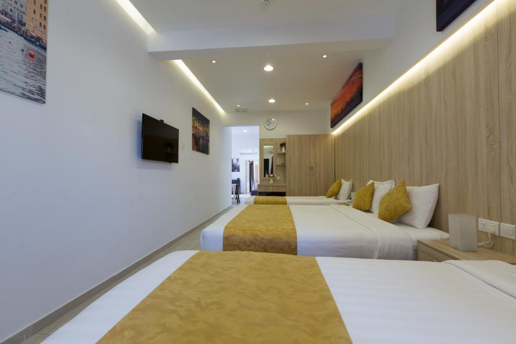 Postel nebo postele na pokoji v ubytování 24 Gold Hotel