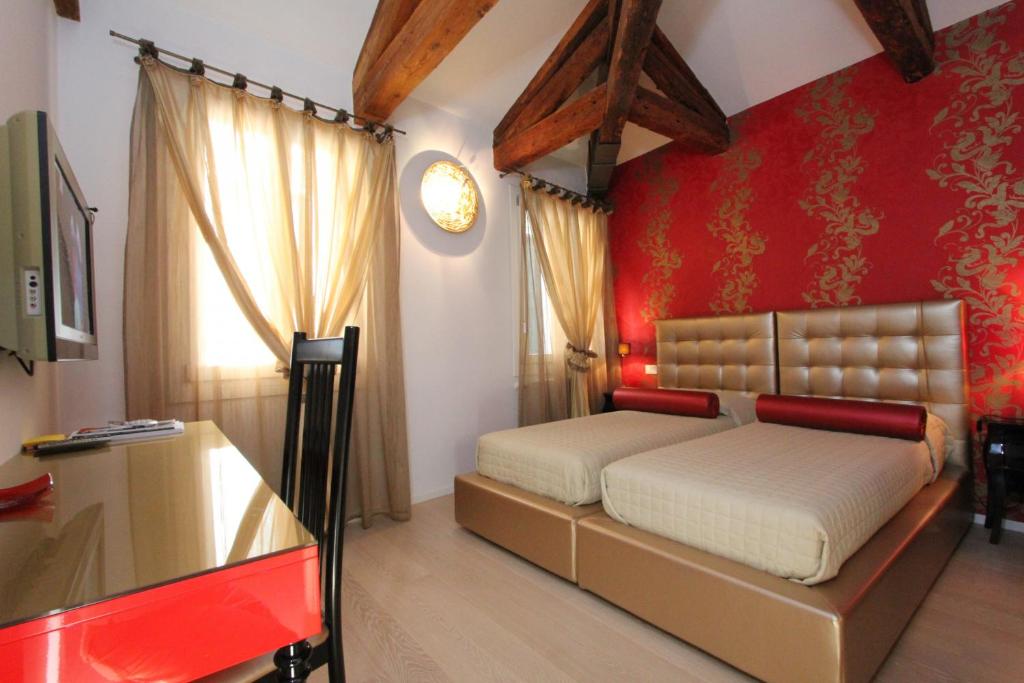 Łóżko lub łóżka w pokoju w obiekcie City Apartments Rialto