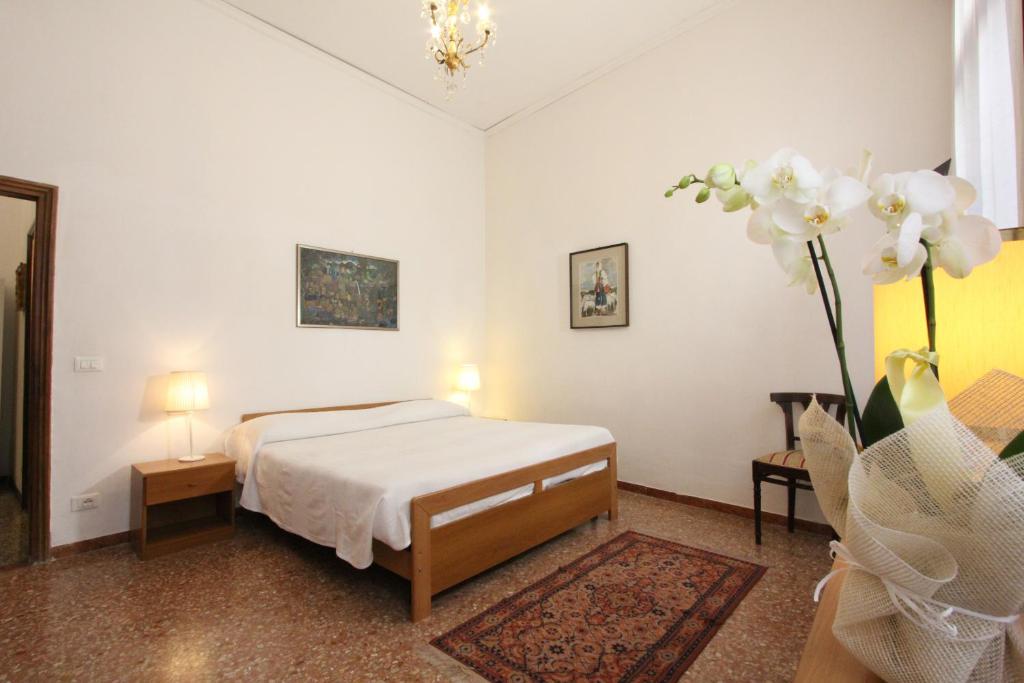 Łóżko lub łóżka w pokoju w obiekcie City Apartments Rialto