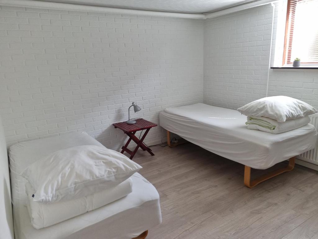 Postel nebo postele na pokoji v ubytování Feriehuse Hvide Sande