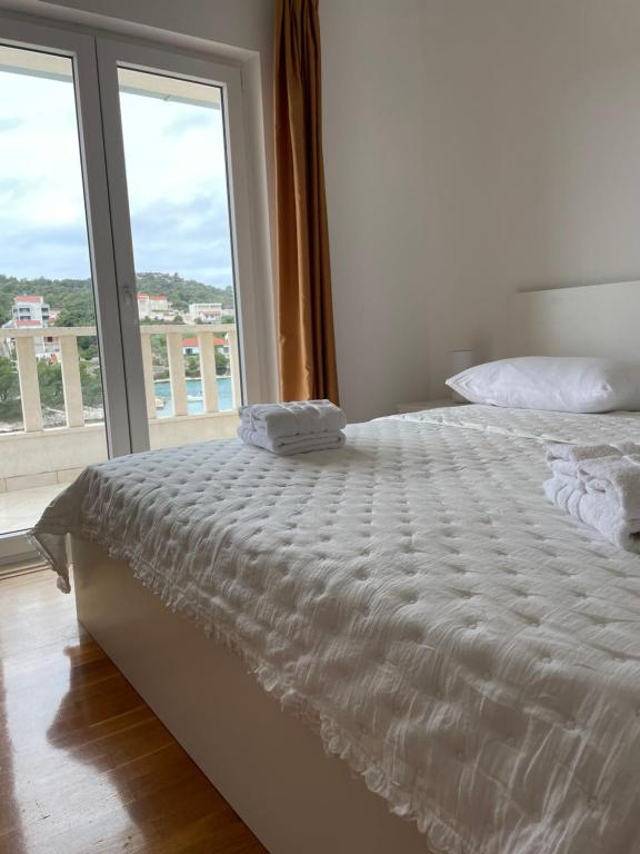 Postel nebo postele na pokoji v ubytování Villa Antoni