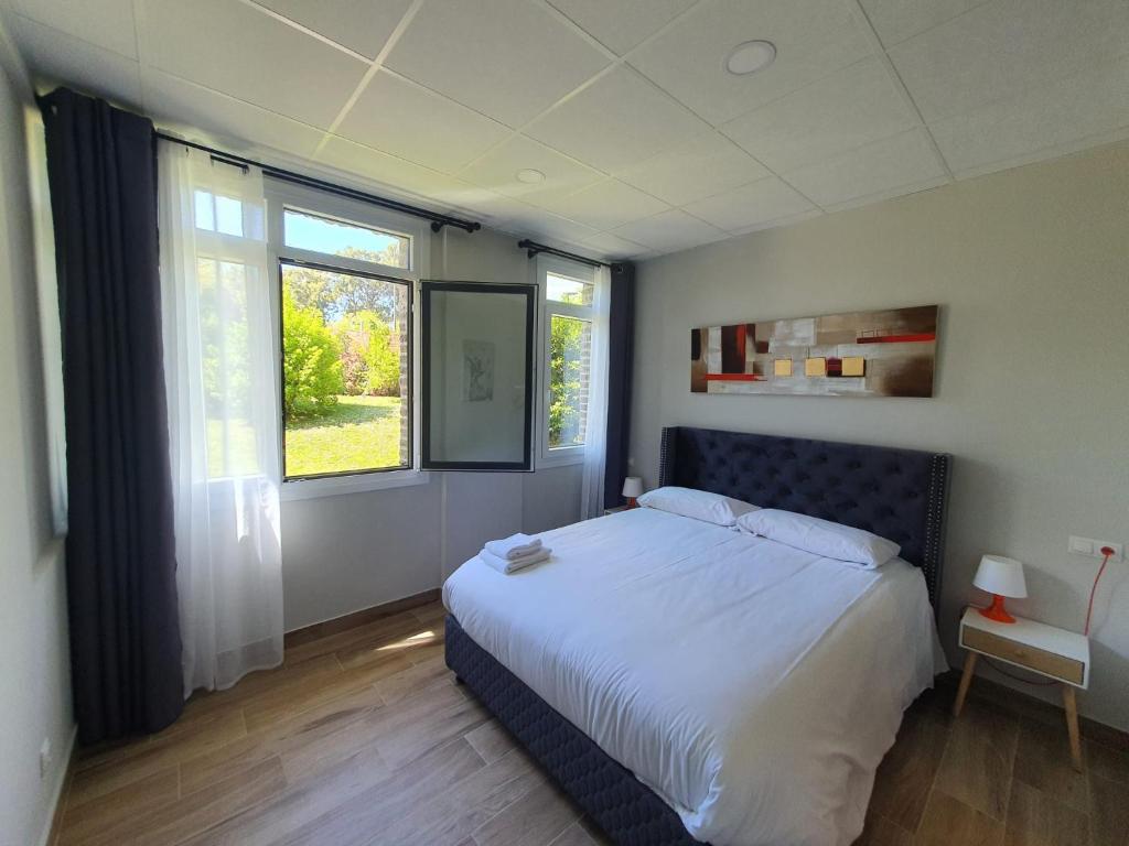 Ένα ή περισσότερα κρεβάτια σε δωμάτιο στο B75 Apartments Bilbao