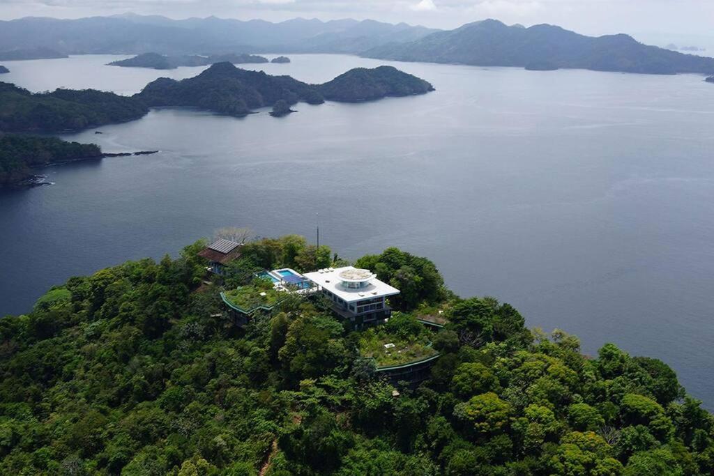 an aerial view of a house on an island in a lake at ISLA SIMCA 