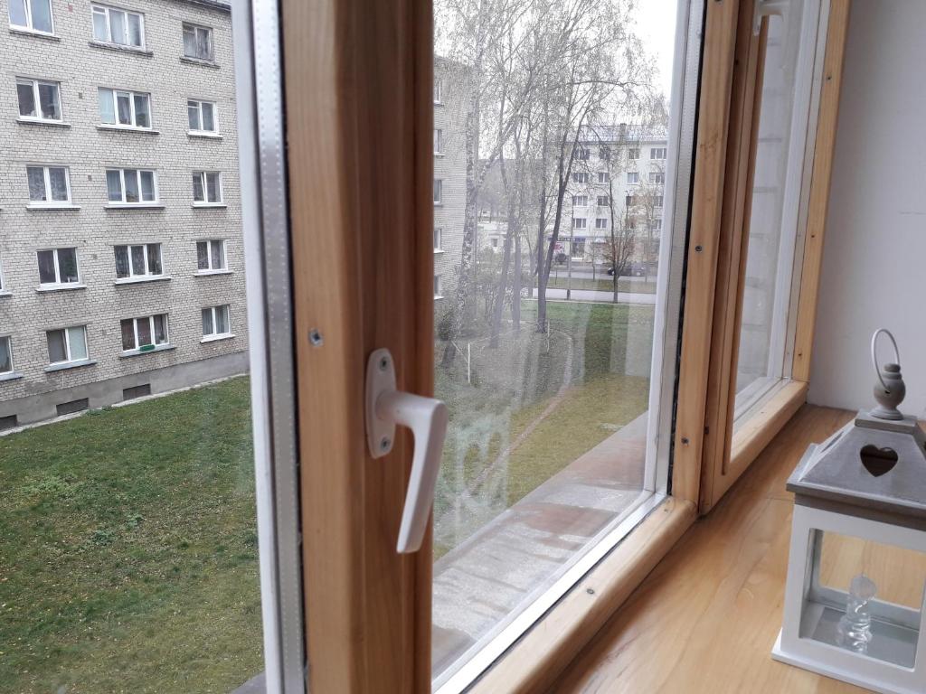 a window with a view of a building at Кандавас 9 in Daugavpils