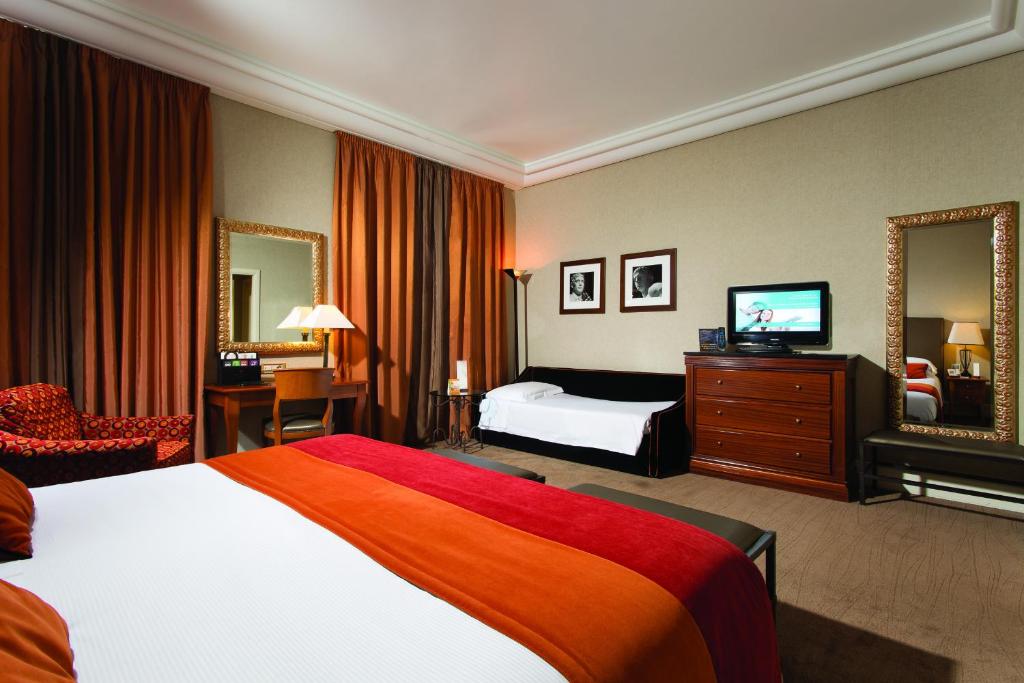 A bed or beds in a room at Hotel dei Mellini