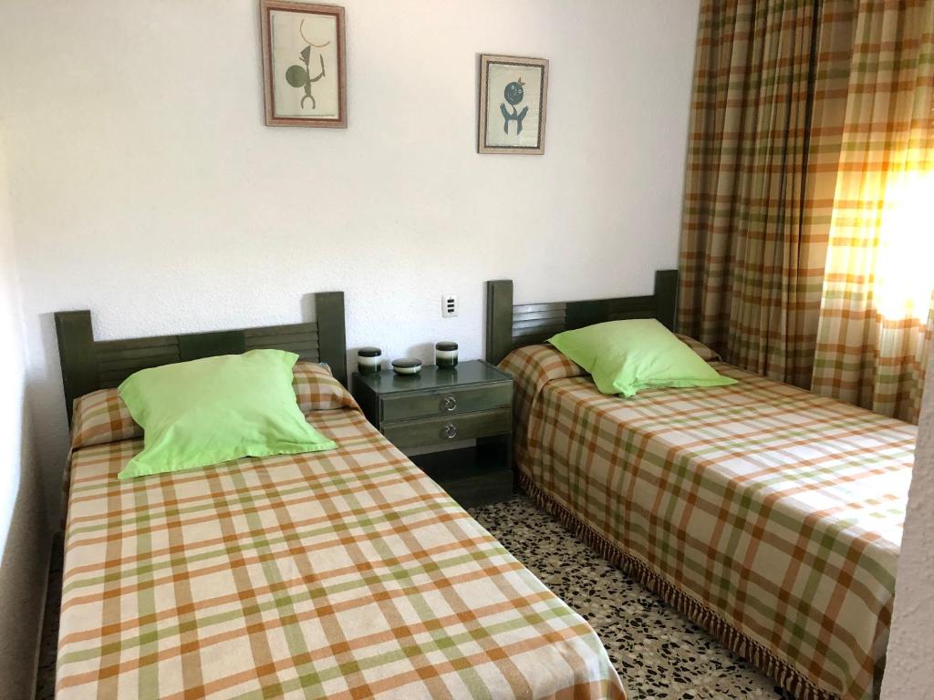 Postel nebo postele na pokoji v ubytování Villa Aeroclub REF. 002
