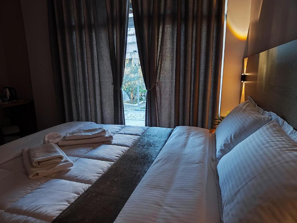 Postel nebo postele na pokoji v ubytování Elvish Garden Boutique B&B