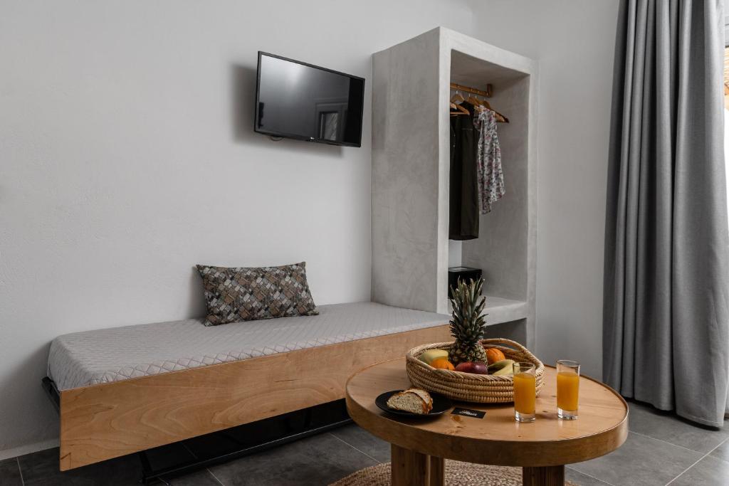 A television and/or entertainment centre at Sunshine Plaka Naxos