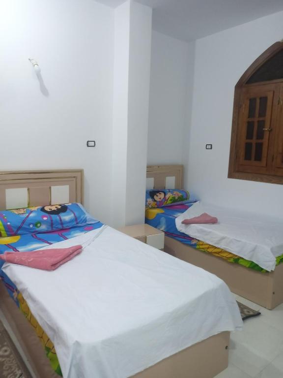 Postel nebo postele na pokoji v ubytování Nubian Bride guest house