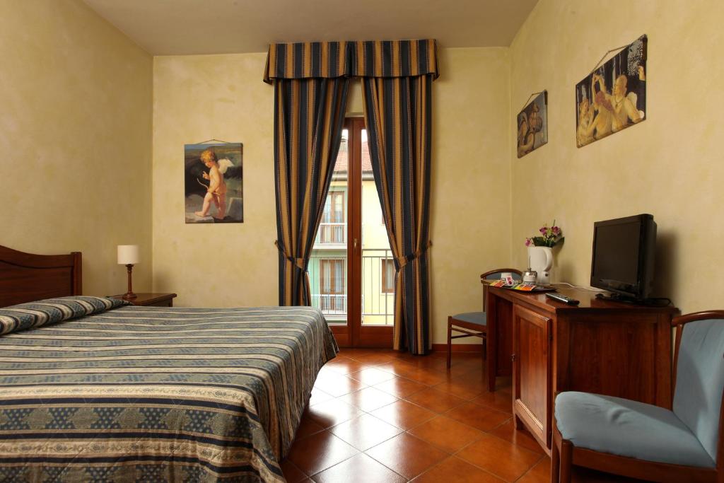 Posteľ alebo postele v izbe v ubytovaní Hotel Bologna
