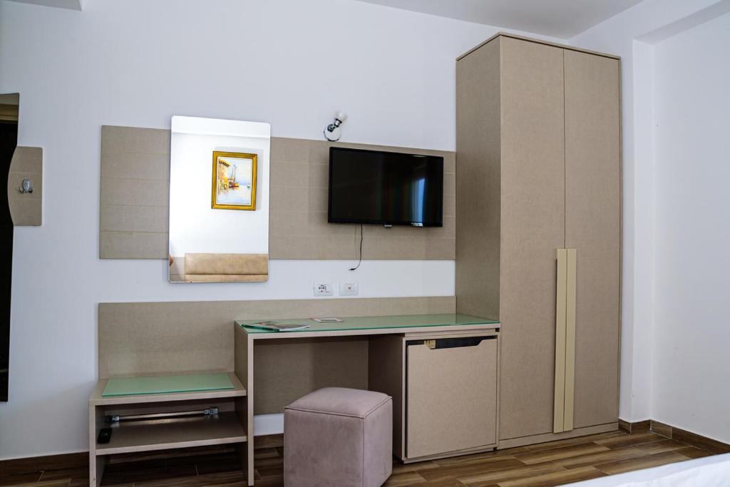 TV a/nebo společenská místnost v ubytování Hotel Orange