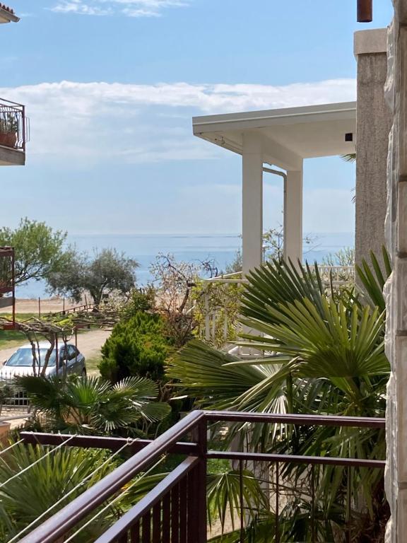 a balcony with a view of the ocean at Apartments Hrnjić in Umag