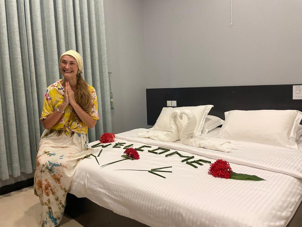 Postel nebo postele na pokoji v ubytování Rihiveli Inn