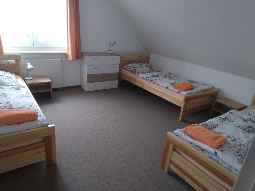 Postel nebo postele na pokoji v ubytování Penzion HORTENZIE