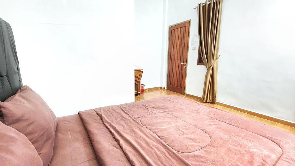 Postel nebo postele na pokoji v ubytování Depik Inn