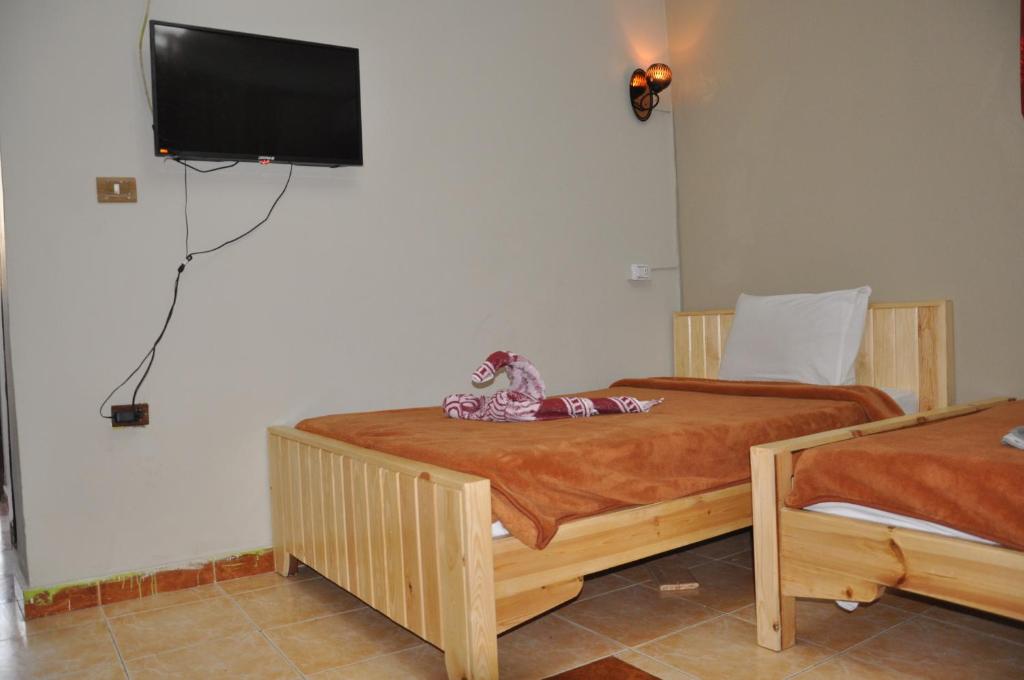 Postel nebo postele na pokoji v ubytování Dahab Plaza Hotel